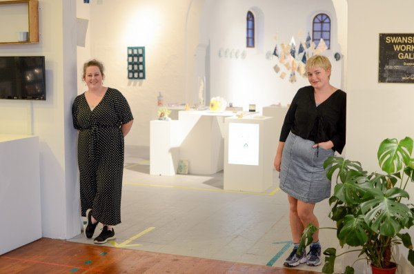 Curators stood by Mission Galleries exhibition space