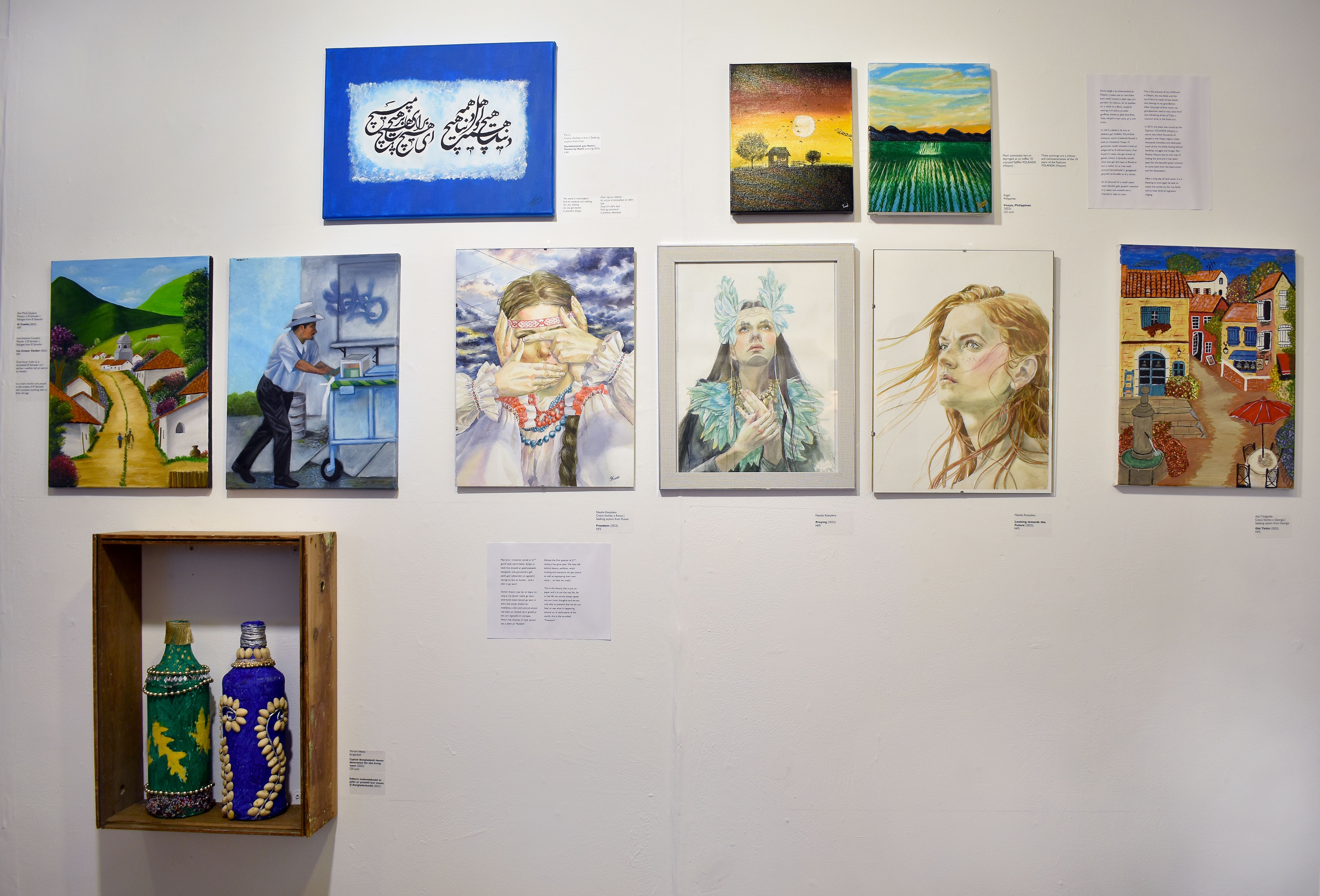 Install images of artworks by local artists seeking asylum in Swansea