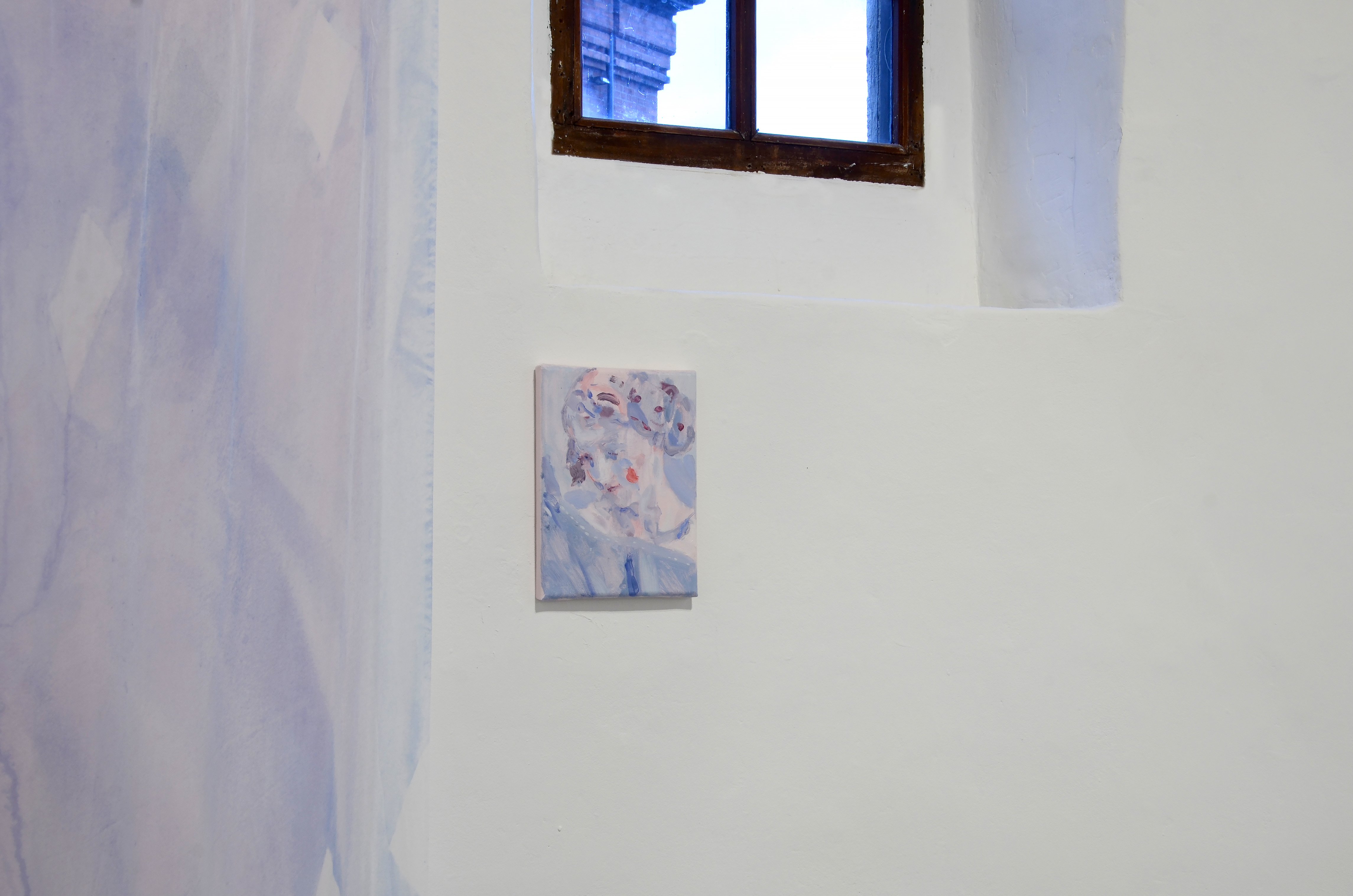 Come fail at love exhibition by Casper White. Image includes a silk veil that falls from ceiling to floor and a painting of a Neapolitan creche figure from The Met Museum