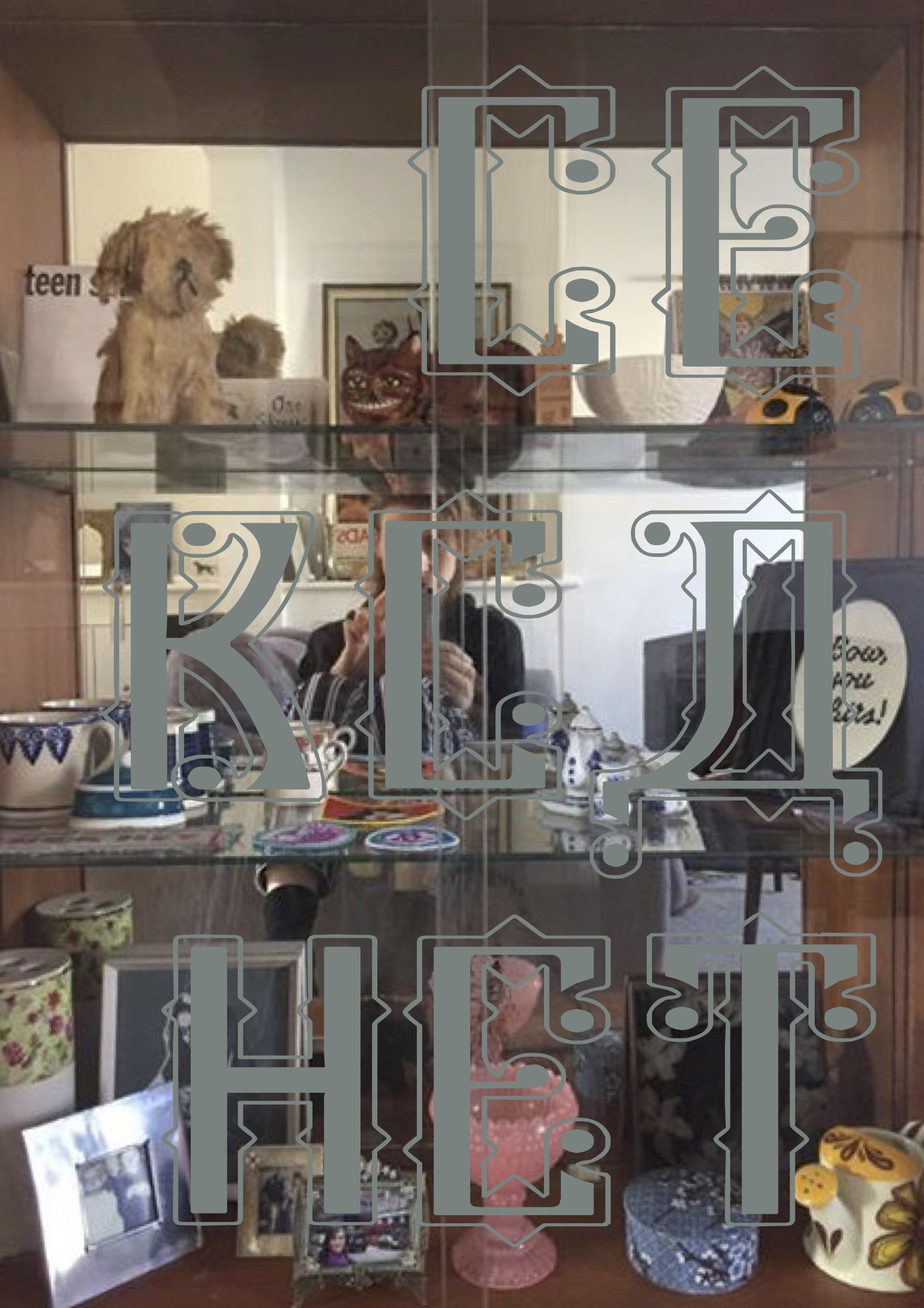 cekca het promo by Cekca Het/Rhiannon Lowe cekca het promo. An image of merchandise behind glass and reflected in mirror at back of cabinet